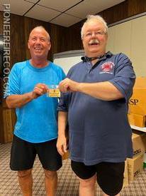 Safety Officer Mumenthaler (L) receives his life membership card from President Bachman (R). 